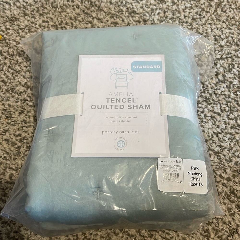 One standard quilted sham. Machine washable. 20” x 26”.